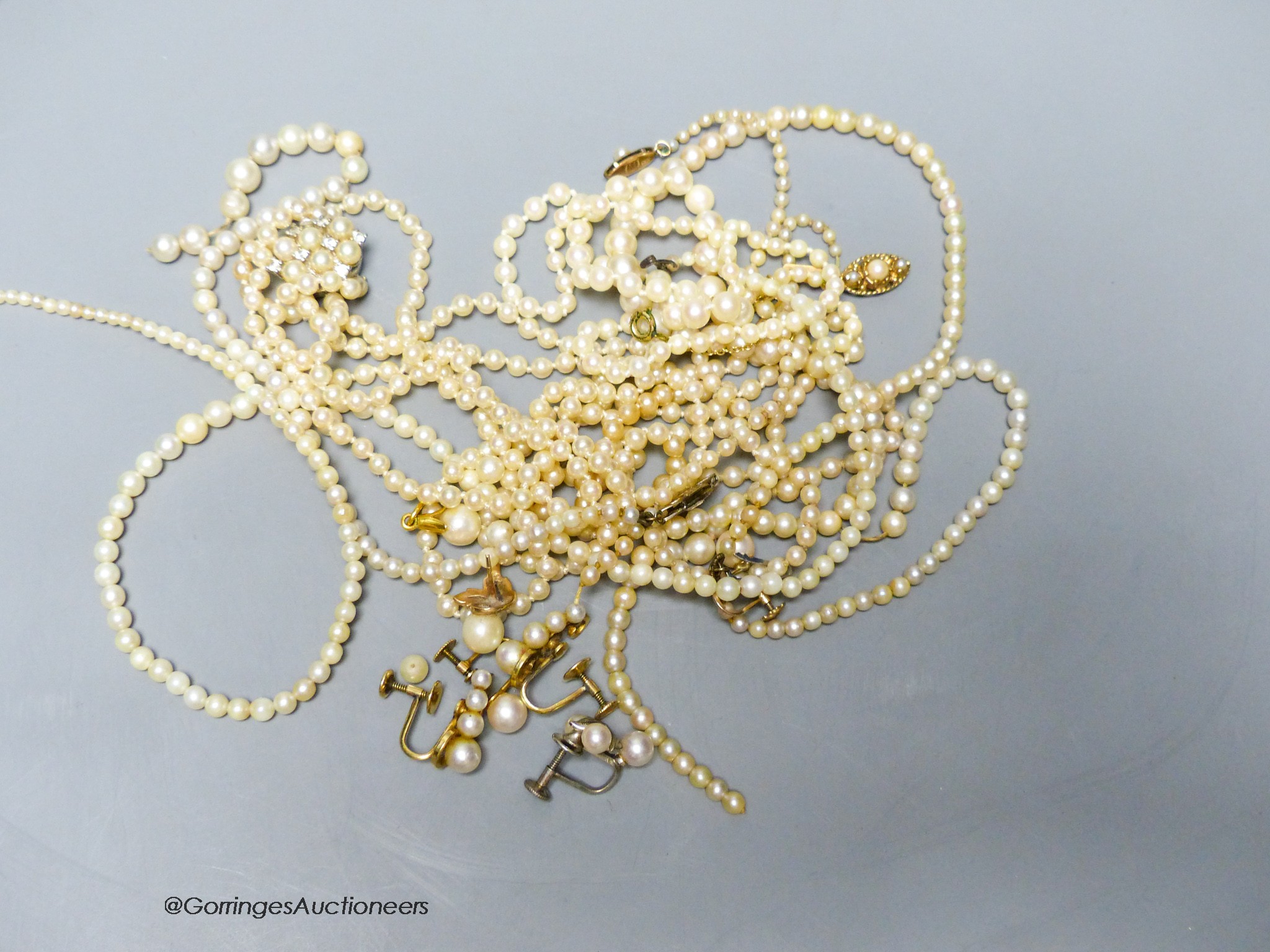 Four assorted single strand cultured pearl necklaces, a similar bracelet(a.f.) and other items including cultured pearl earrings and simulated pearl necklace.